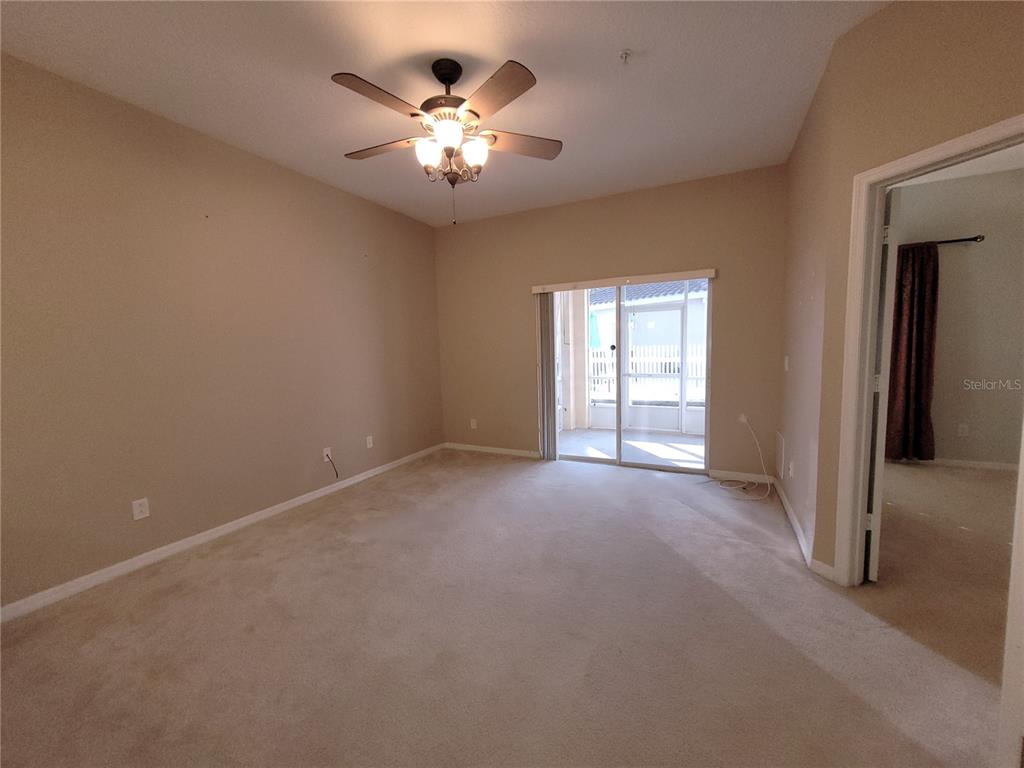 673 Sandy Neck Lane, Unit 101 Altamonte Springs, FL 32714 - Photo 4 of 39 a view of a livingroom with a chandelier fan and windows