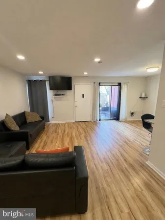 a bed room with a bed and a television