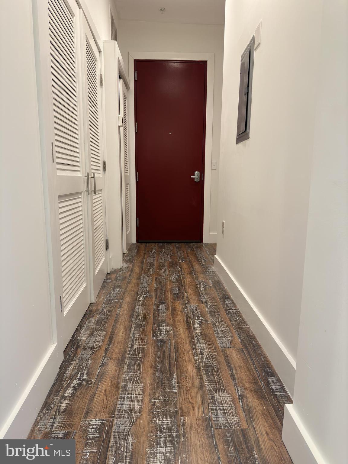 2206 North Front Street, Unit 2B Philadelphia, PA 19133 - Photo 11 of 28 a view of a hallway with wooden floor and a bathroom
