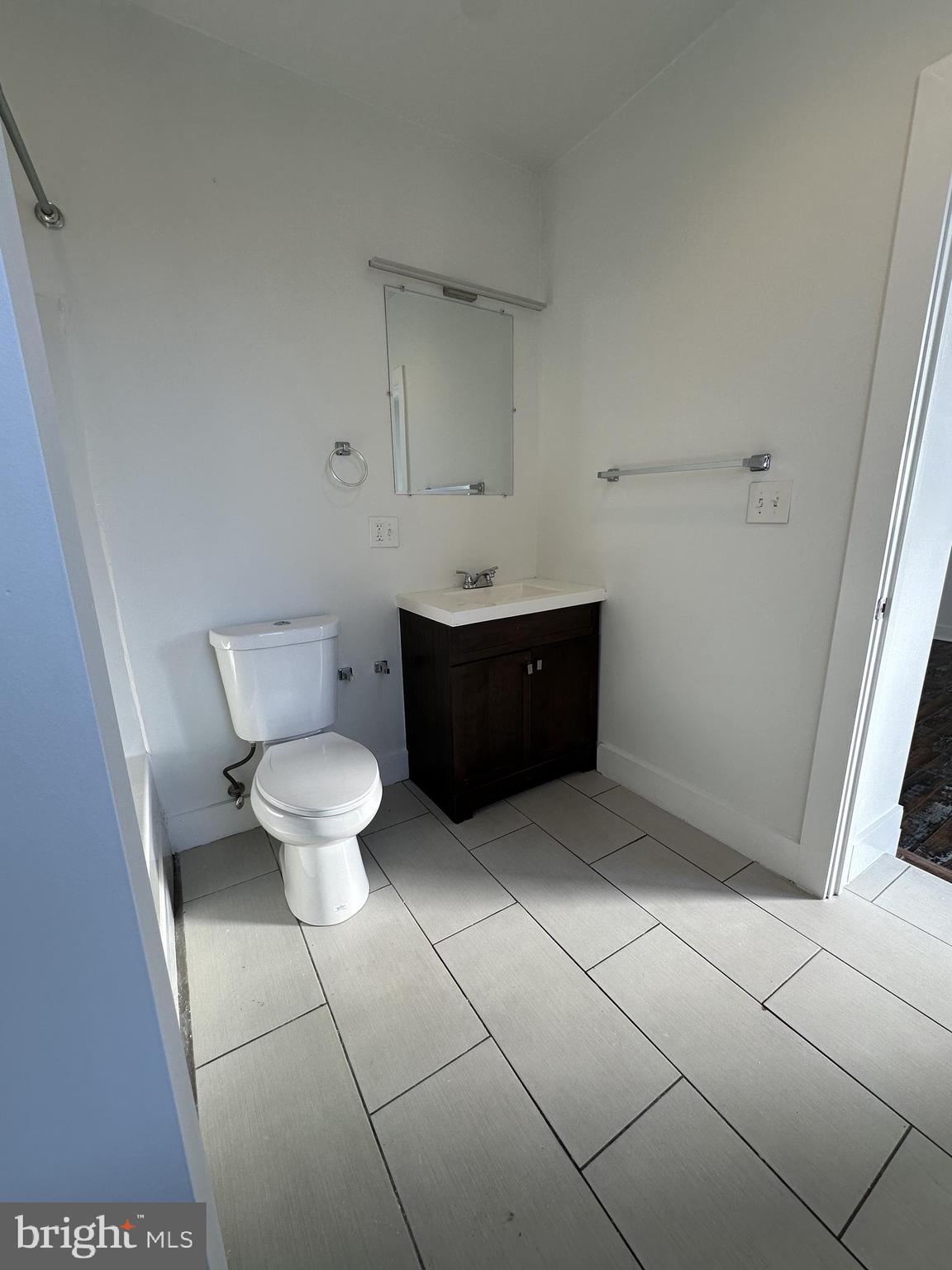 2206 North Front Street, Unit 2B Philadelphia, PA 19133 - Photo 16 of 28 a bathroom with a toilet and a sink