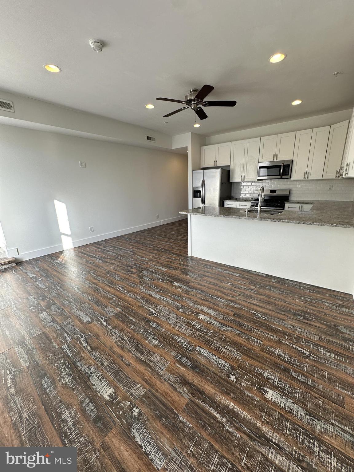 2206 North Front Street, Unit 2B Philadelphia, PA 19133 - Photo 22 of 28 a view of a living room kitchen