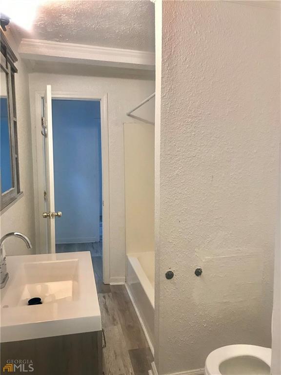 116 Edwards Street Bremen, GA 30110 - Photo 23 of 33 a bathroom with a sink and a mirror