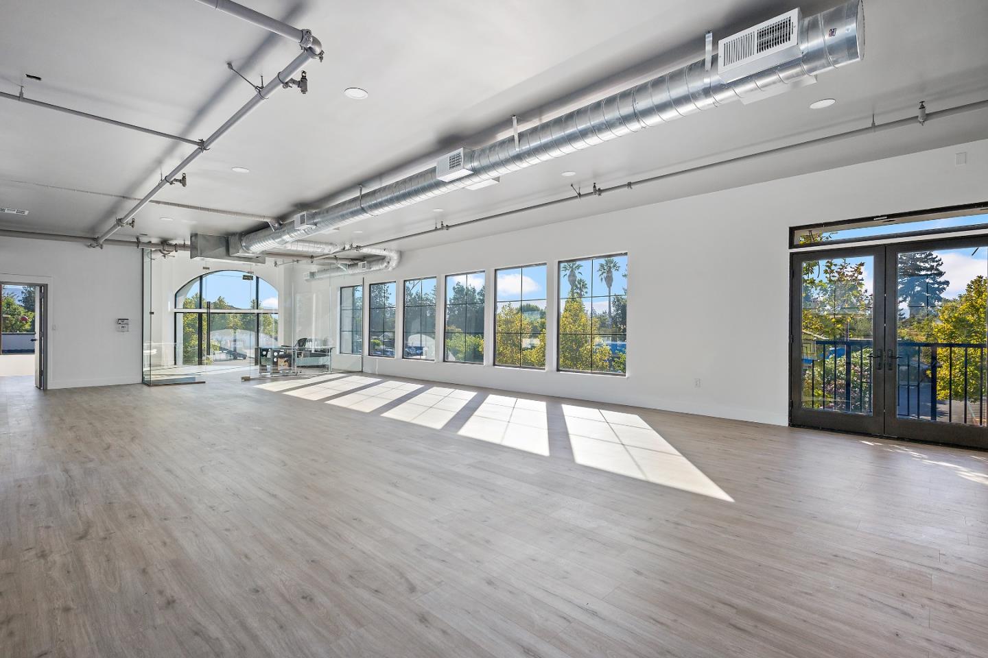 2220 Winchester Boulevard Campbell, CA 95008 - Photo 11 of 26 a view of an empty room with wooden floor and a window
