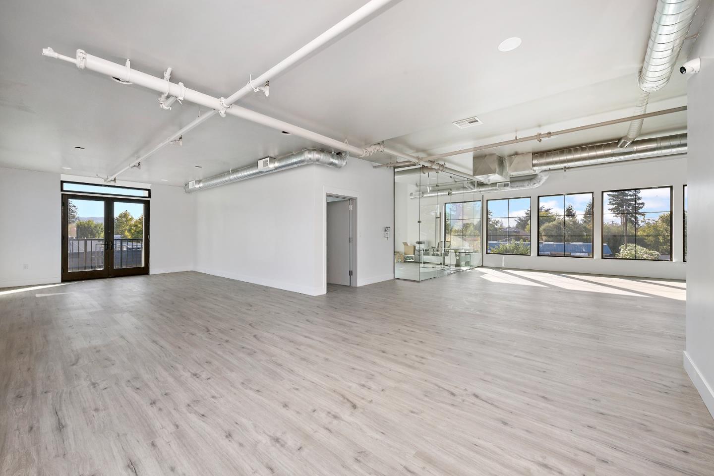 2220 Winchester Boulevard Campbell, CA 95008 - Photo 15 of 26 a view of an empty room with wooden floor and a window