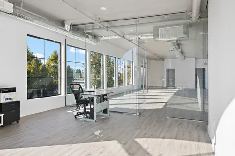 a view of an entryway with wooden floor