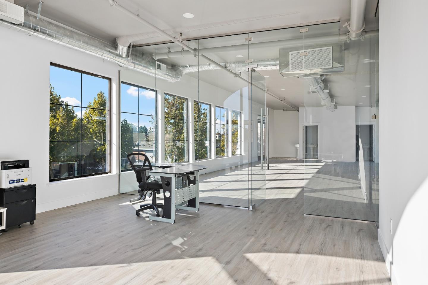 2220 Winchester Boulevard Campbell, CA 95008 - Photo 18 of 26 a dining room with wooden floor and a chandelier