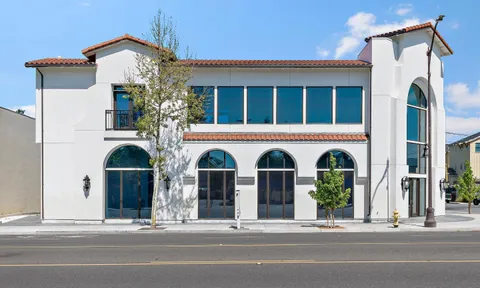 a view of an empty room with windows