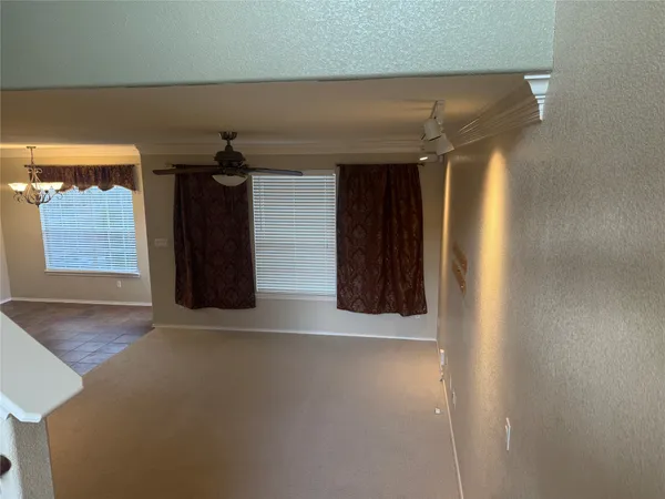 a view of a hallway with wooden walls