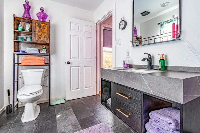 a kitchen with a sink cabinets and a window