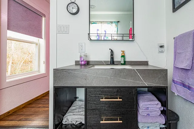 a kitchen with stainless steel appliances a stove a refrigerator and cabinets