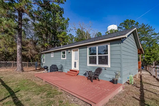 a front view of a house with a swimming pool