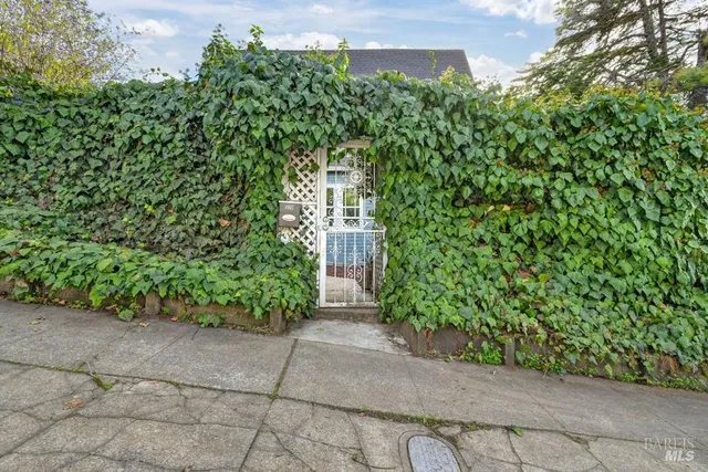 a view of dining room with furniture and a chandelier