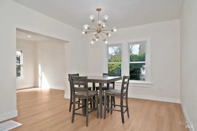 a kitchen with stainless steel appliances white cabinets and a sink