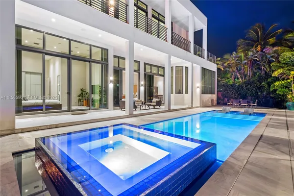 a view of a kitchen with swimming pool and sitting area