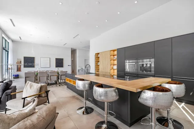 a living room with furniture and flat screen tv