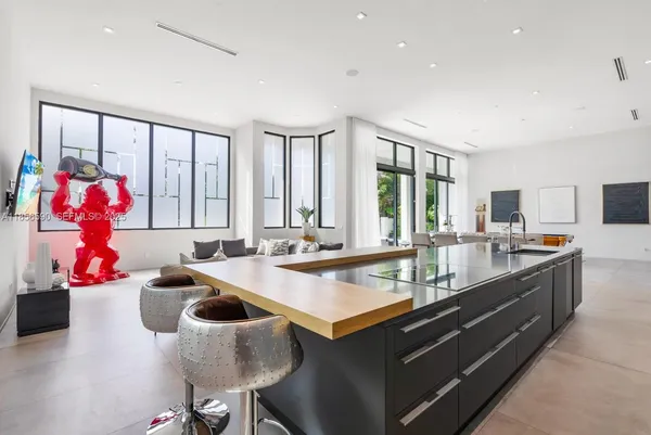 a large kitchen with kitchen island granite countertop a large counter top space
