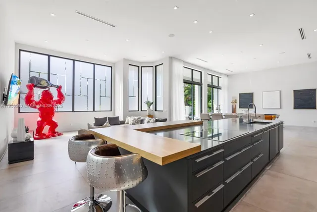 a large kitchen with kitchen island granite countertop a large counter top space