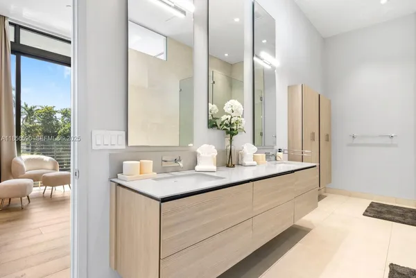 a bedroom with a bed and large window