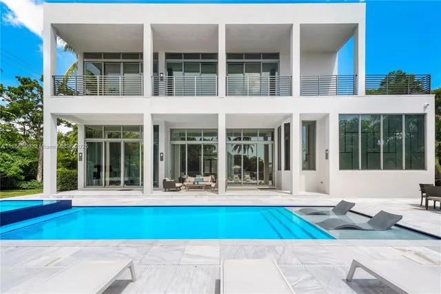 a building with potted plants in front of it