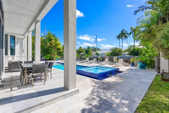 a front view of a house with a yard and a garden