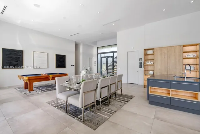 a living room with furniture and flat screen tv