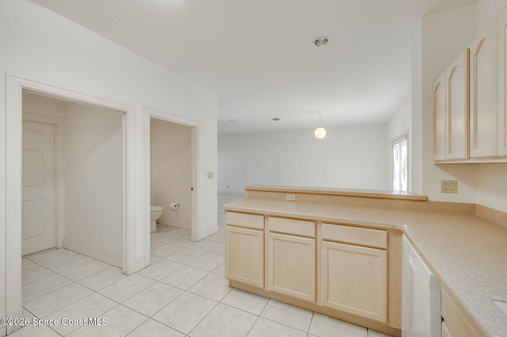 624 Cedar Side Circle Northeast Palm Bay, FL 32905 - Photo 12 of 35 a view of a kitchen with white cabinets