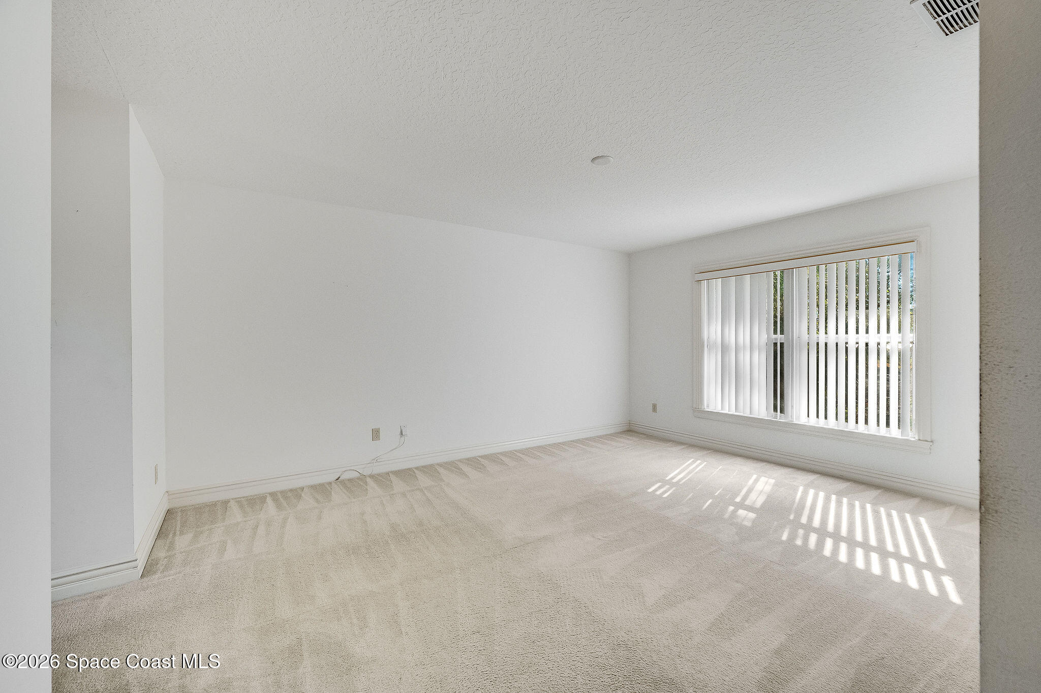 624 Cedar Side Circle Northeast Palm Bay, FL 32905 - Photo 17 of 35 an empty room with a window