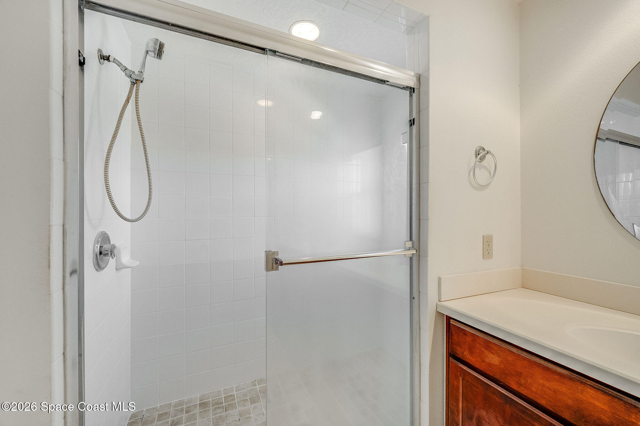 624 Cedar Side Circle Northeast Palm Bay, FL 32905 - Photo 21 of 35 a bathroom with a shower and a mirror
