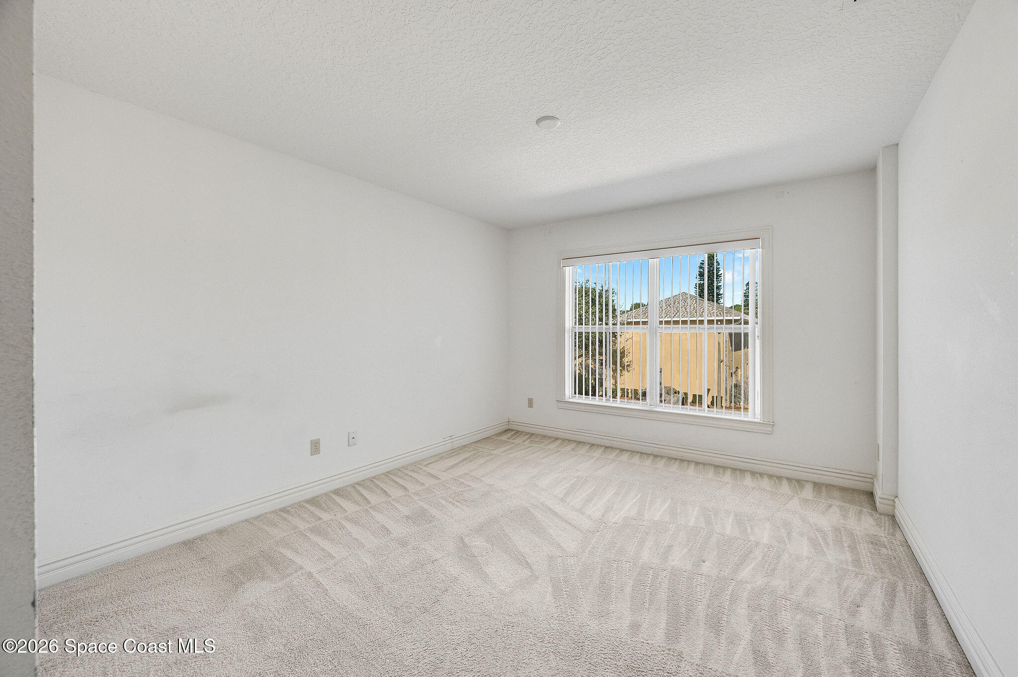 624 Cedar Side Circle Northeast Palm Bay, FL 32905 - Photo 23 of 35 an empty room with a window