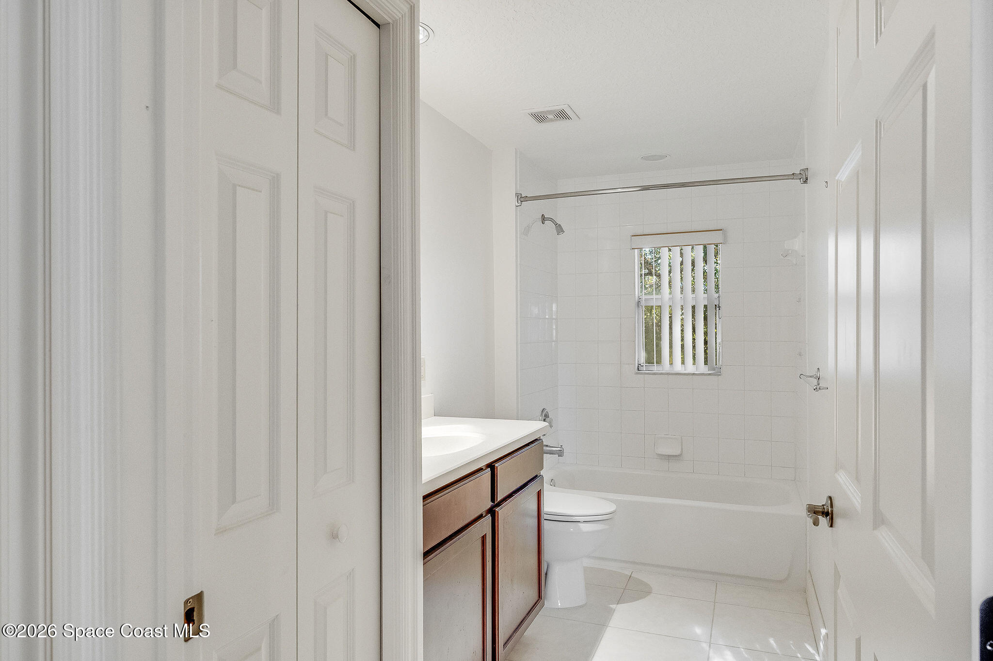 624 Cedar Side Circle Northeast Palm Bay, FL 32905 - Photo 25 of 35 a bathroom with a bathtub and a shower