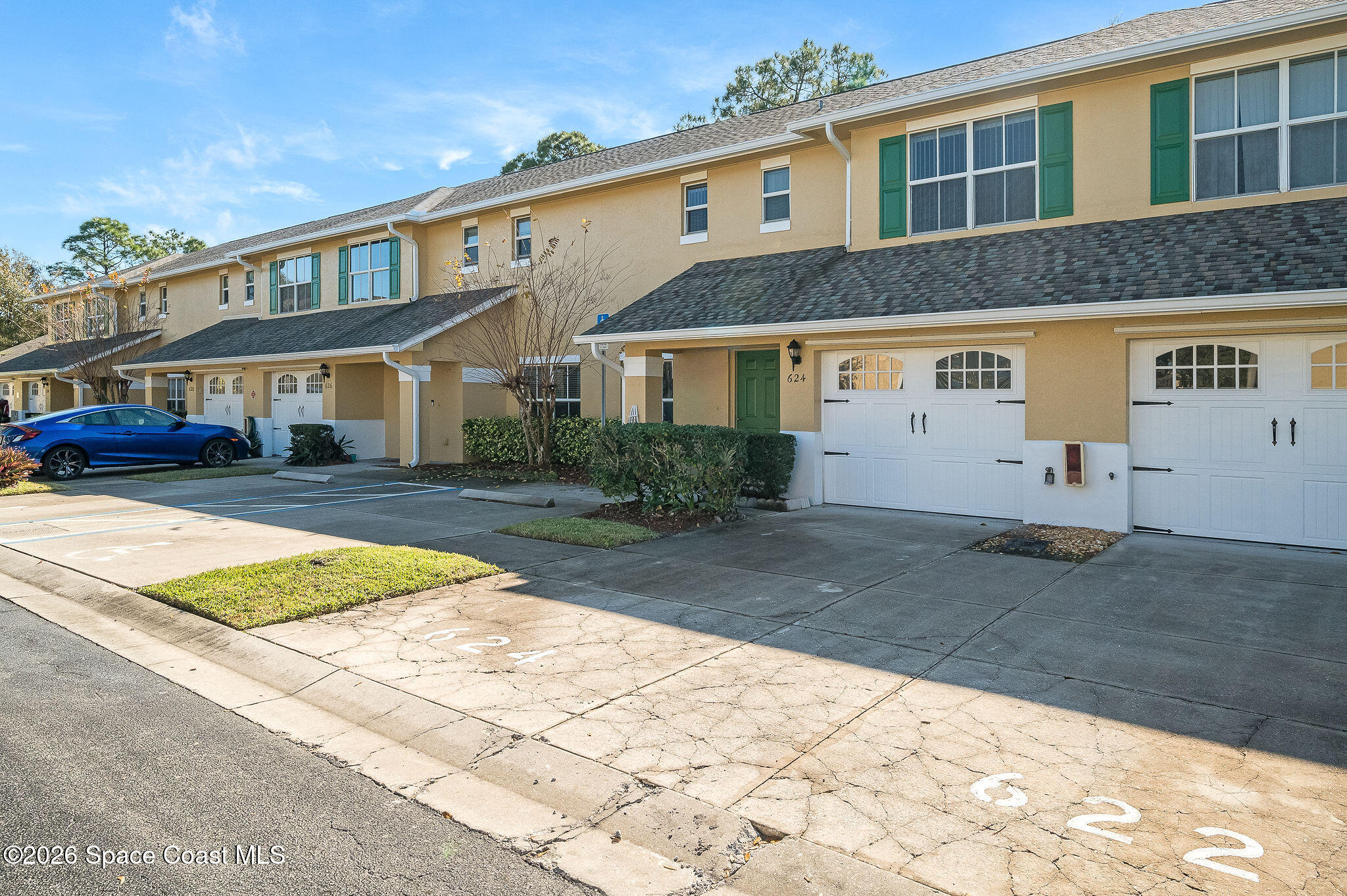 624 Cedar Side Circle Northeast Palm Bay, FL 32905 - Photo 31 of 35 a front view of a house with a yard