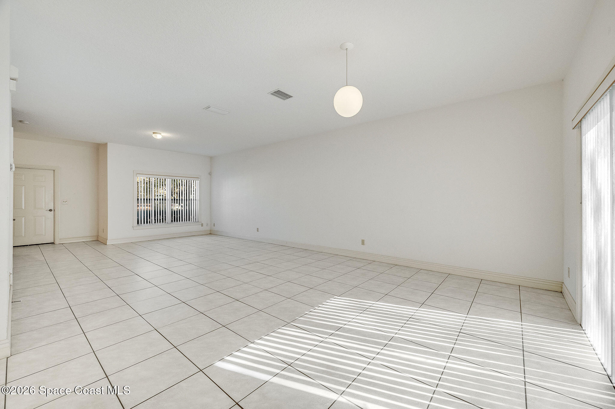 624 Cedar Side Circle Northeast Palm Bay, FL 32905 - Photo 8 of 35 a view of an empty room and a window