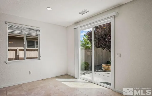 a view of a room with a large window