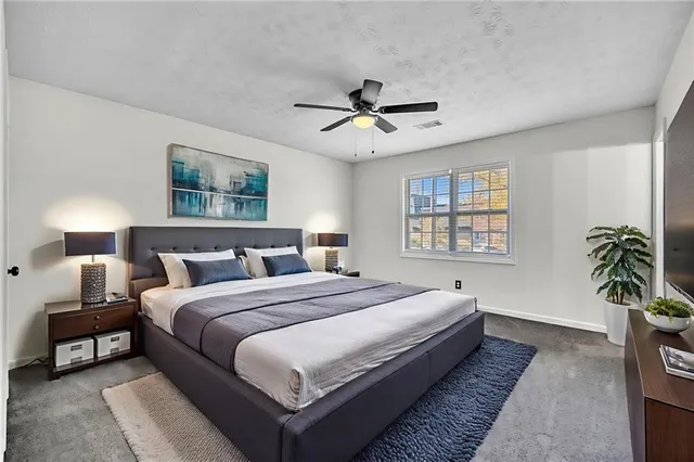 a bedroom with bed and a window