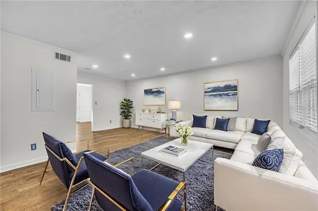a living room with furniture and a table