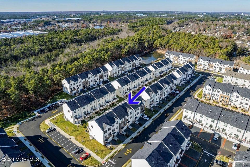 304 Discovery Road, Unit 1804 Brick, NJ 08723 - Photo 3 of 48 an aerial view of a balcony with chairs
