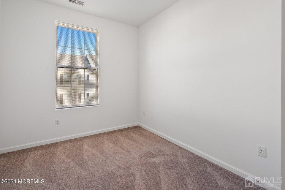 304 Discovery Road, Unit 1804 Brick, NJ 08723 - Photo 32 of 48 a view of an empty room with a window
