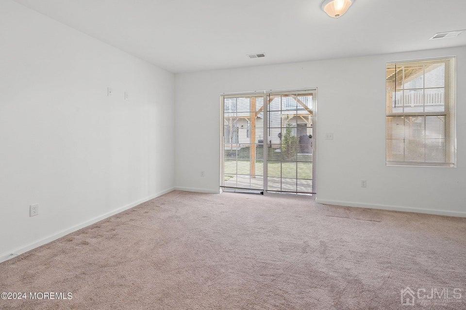 304 Discovery Road, Unit 1804 Brick, NJ 08723 - Photo 37 of 48 an empty room with windows