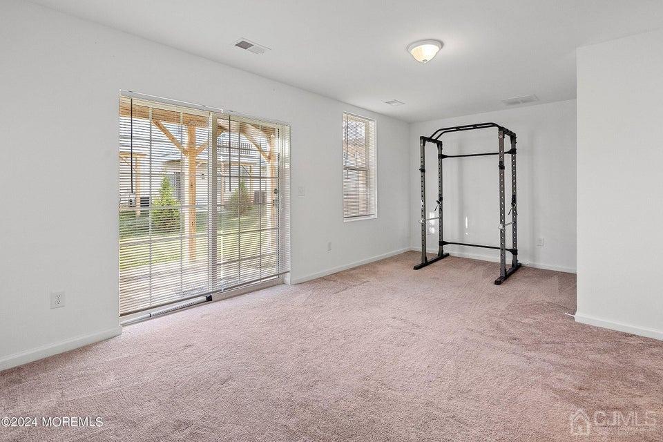 304 Discovery Road, Unit 1804 Brick, NJ 08723 - Photo 38 of 48 an empty room with windows