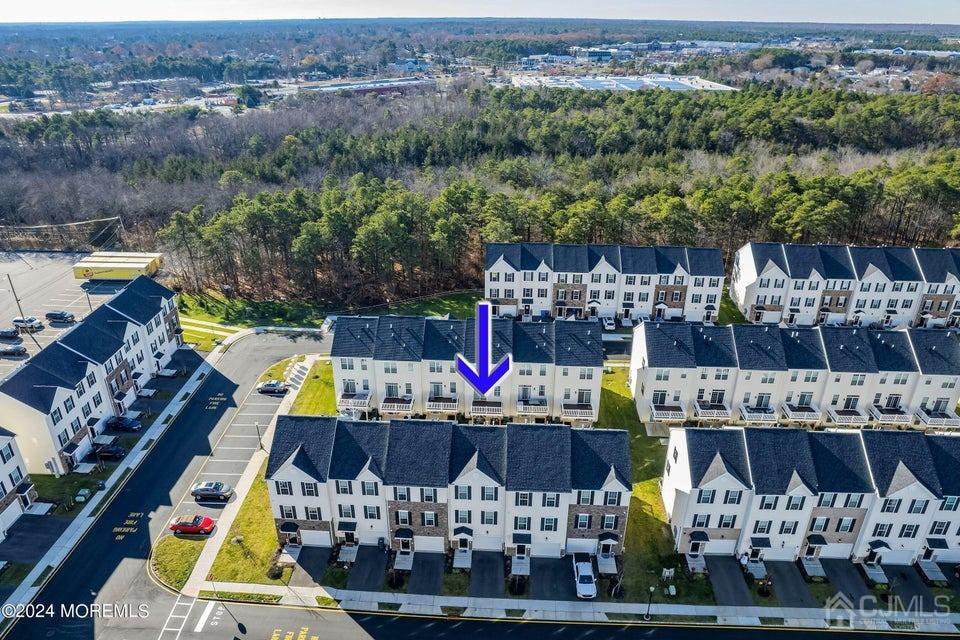 304 Discovery Road, Unit 1804 Brick, NJ 08723 - Photo 4 of 48 a view of swimming pool with outdoor seating and city view