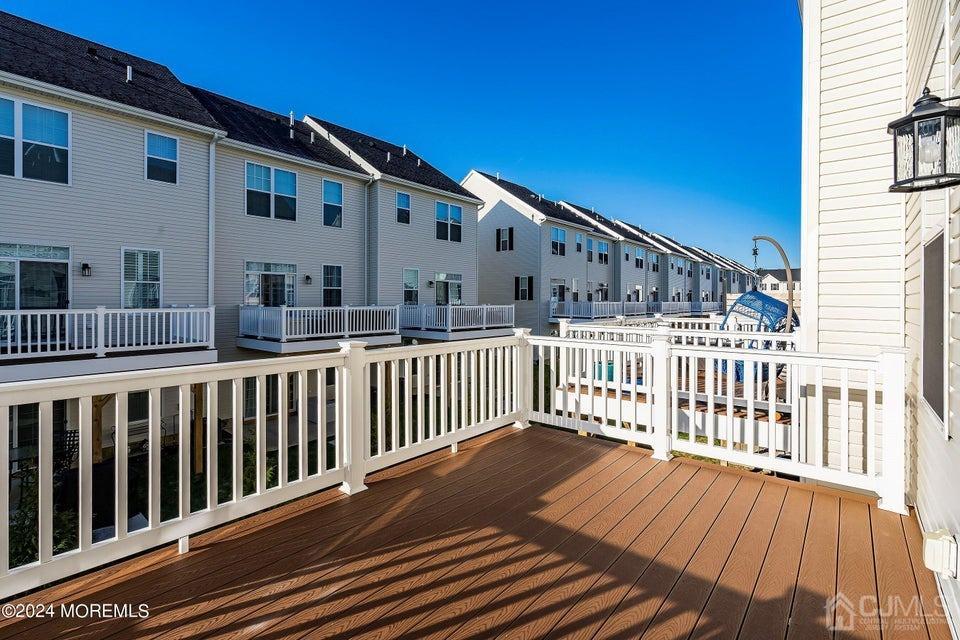 304 Discovery Road, Unit 1804 Brick, NJ 08723 - Photo 43 of 48 a view of a house with wooden deck