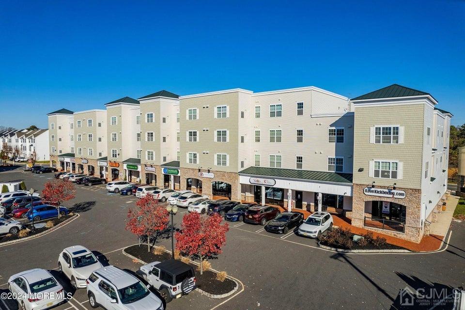 304 Discovery Road, Unit 1804 Brick, NJ 08723 - Photo 45 of 48 a view of a building with sitting area