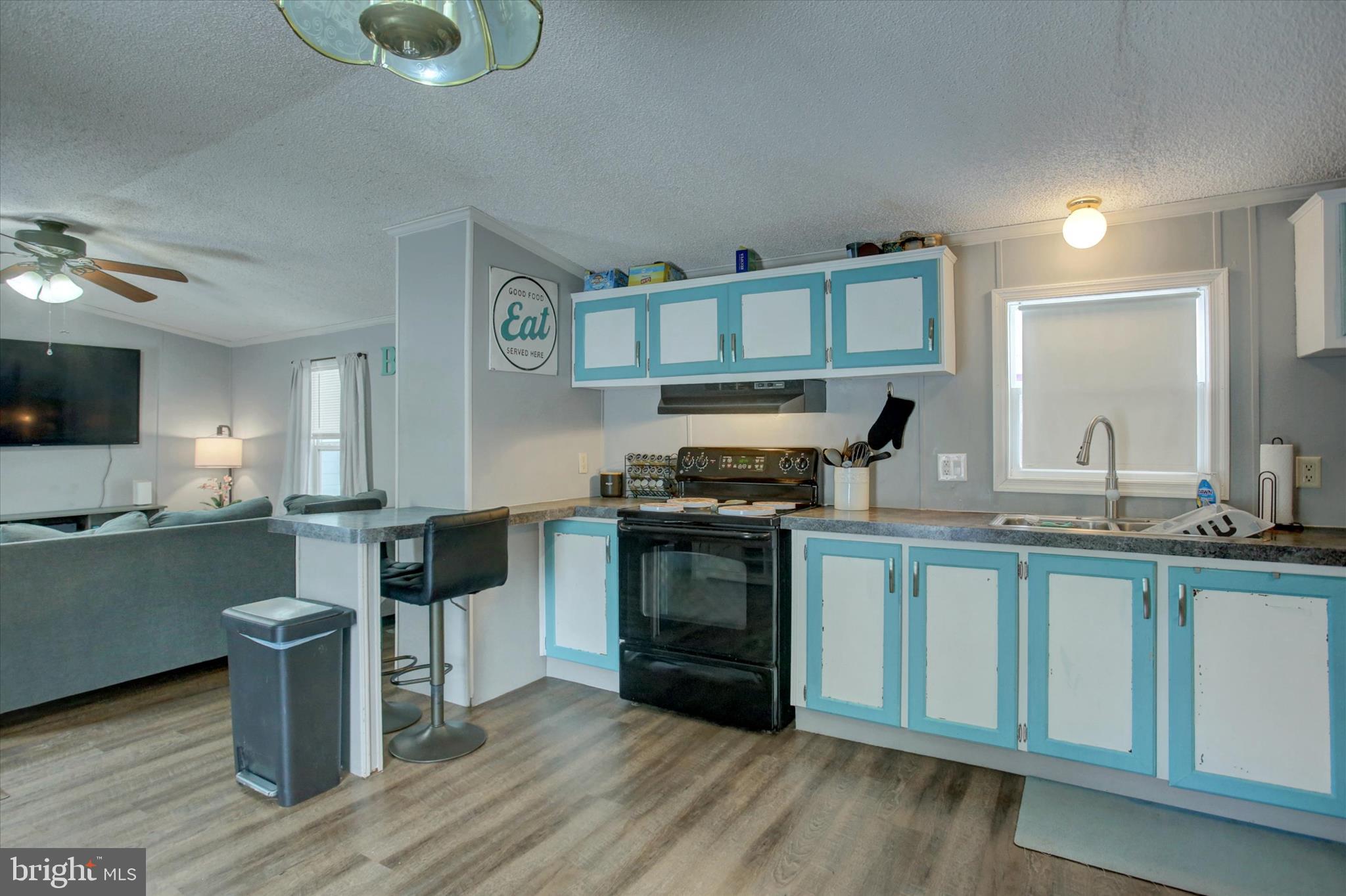 188 Rustic Drive Shippensburg, PA 17257 - Photo 12 of 24 a kitchen with a sink cabinets and wooden floor