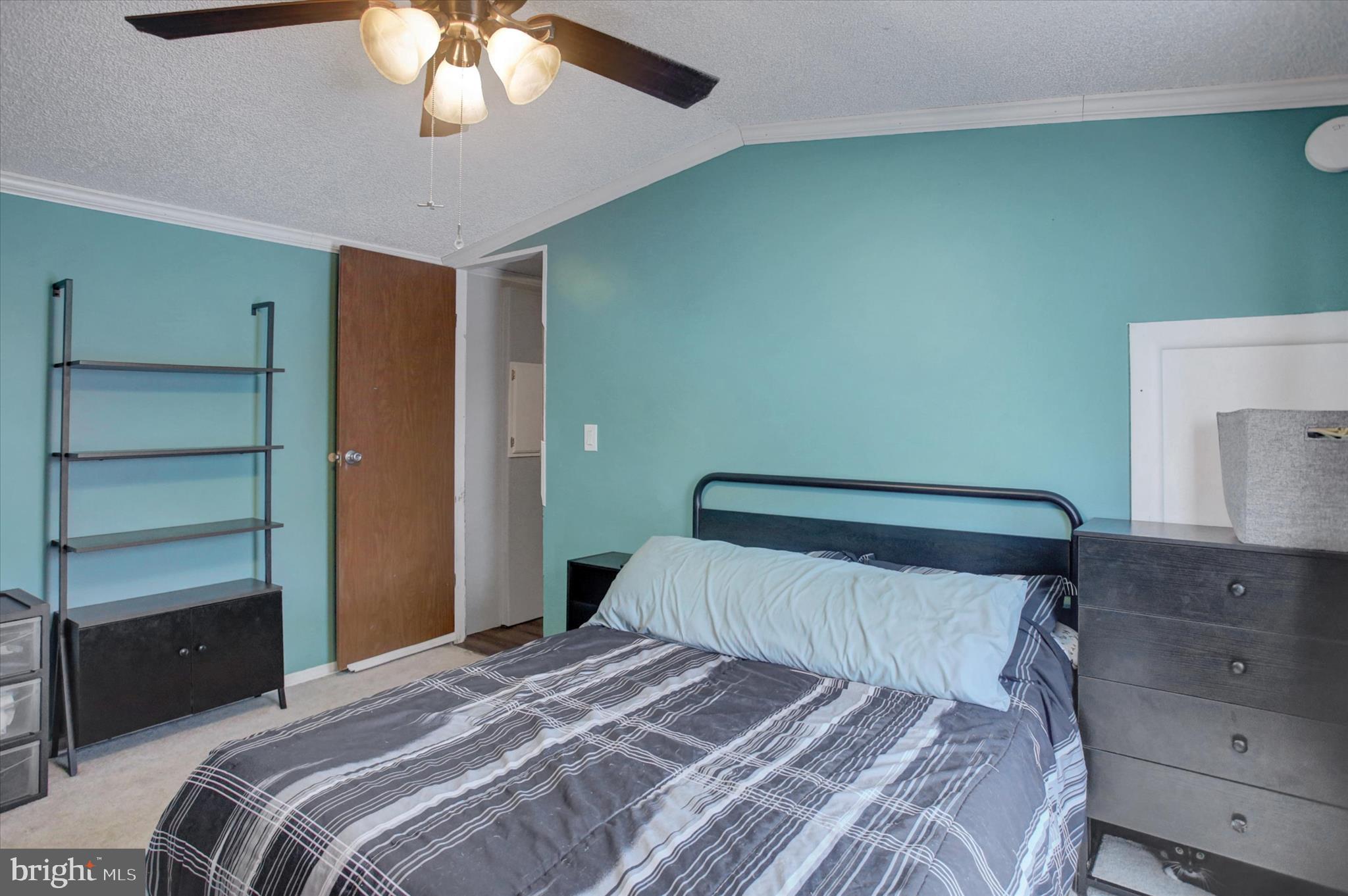 188 Rustic Drive Shippensburg, PA 17257 - Photo 17 of 24 a bedroom with a bed and a chandelier