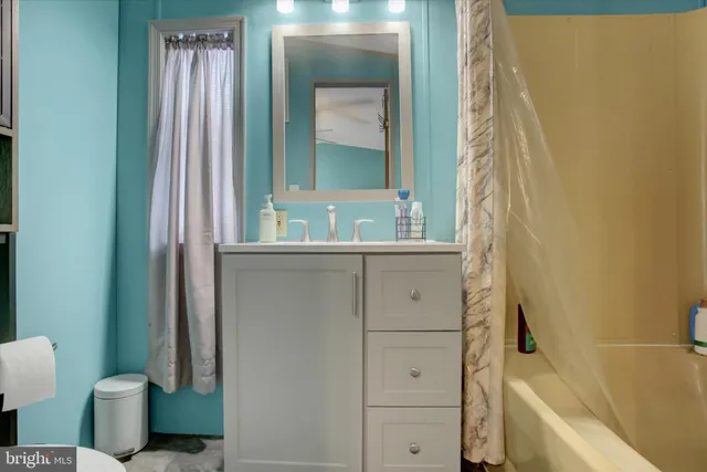 a bathroom with a bathtub sink and toilet
