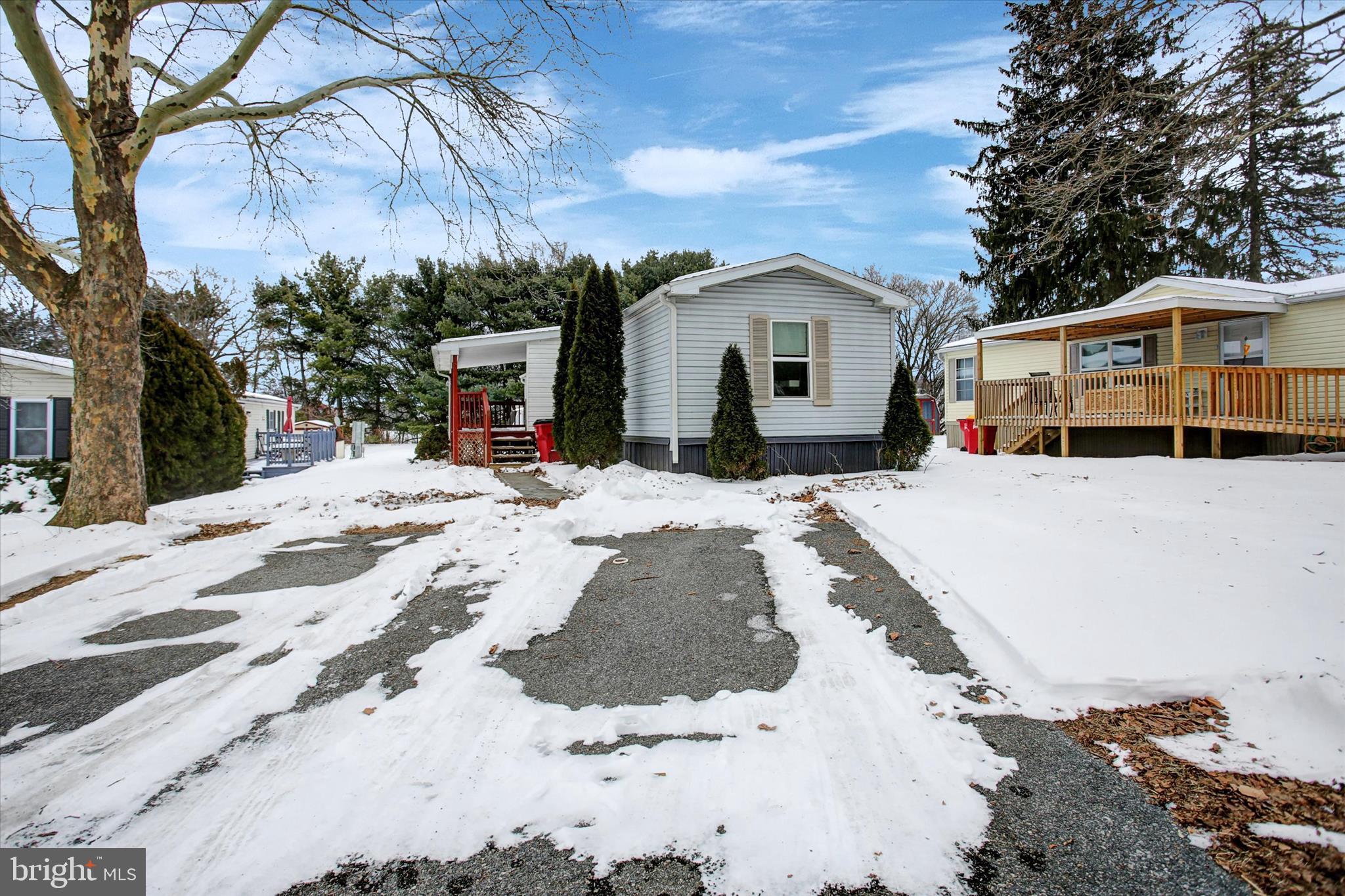 188 Rustic Drive Shippensburg, PA 17257 - Photo 22 of 24 a view of a white house covered in snow