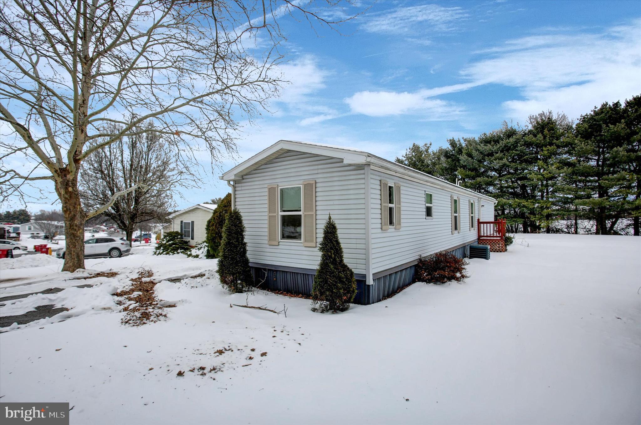 188 Rustic Drive Shippensburg, PA 17257 - Photo 23 of 24 a front view of a house with a yard covered in snow