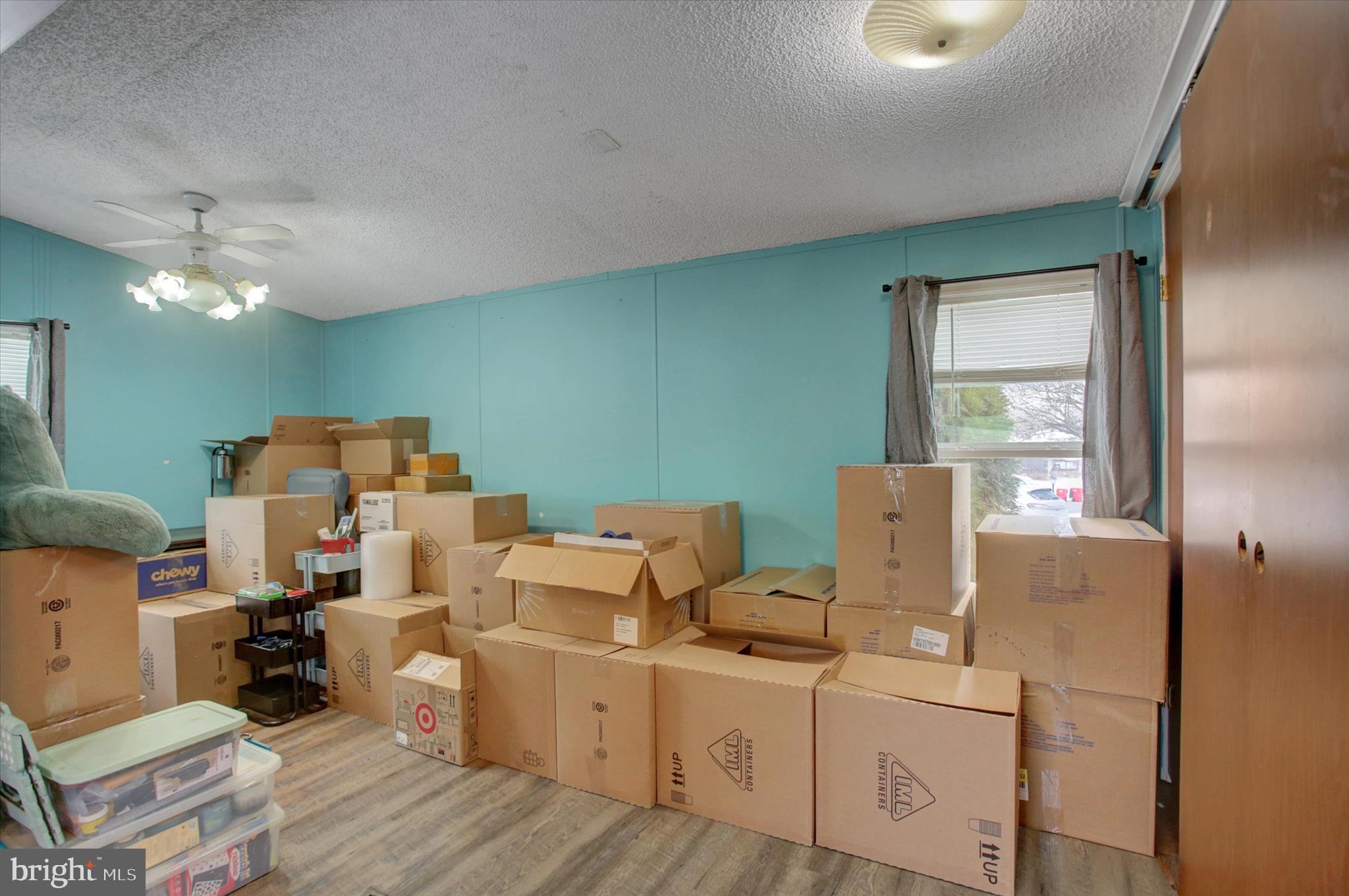 188 Rustic Drive Shippensburg, PA 17257 - Photo 7 of 24 a living room with furniture and a chandelier