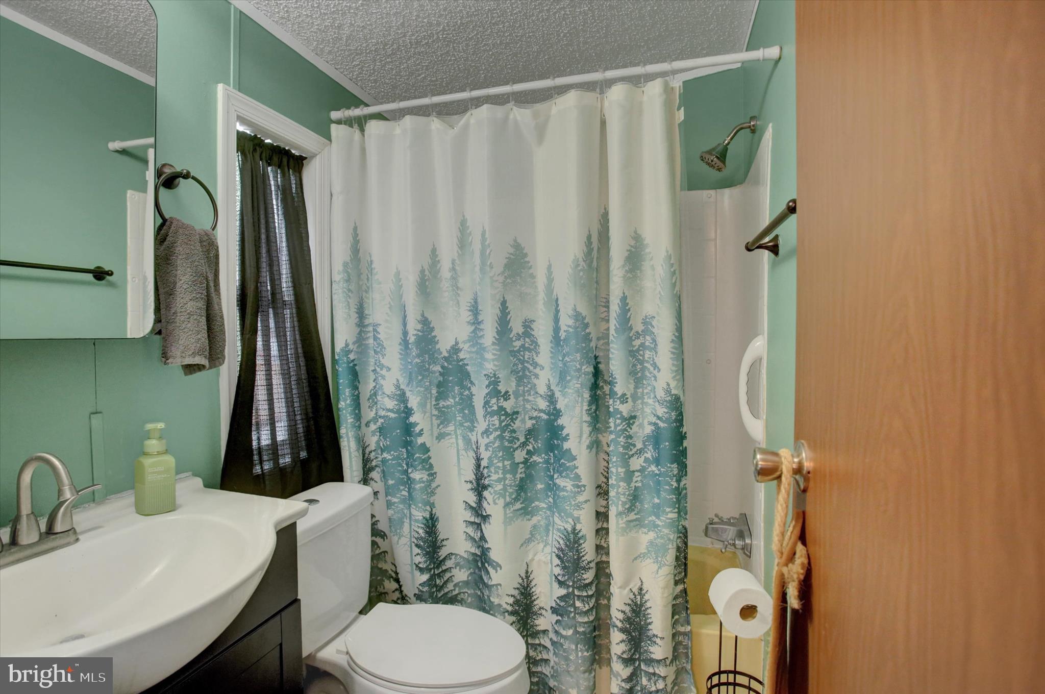 188 Rustic Drive Shippensburg, PA 17257 - Photo 8 of 24 a bathroom with a sink toilet and shower