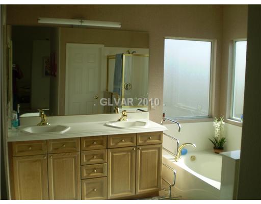 3736 Port Ritchey Street Las Vegas, NV 89147 - Photo 15 of 25 Master Bath/Spa. Raised double sink in master bath with upgraded light fixture